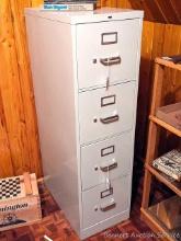 Located upstairs, bring help to remove. Four drawer file cabinet stands 52" tall x 15" wide x 25"