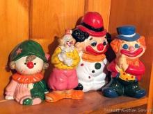 Located upstairs, bring help to remove. Four clown coin banks, tallest is approx. 9-1/2".