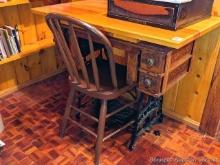 Located upstairs, bring help to remove. Treadle sewing machine cabinet with added top and wooden