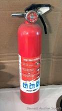No shipping. First Alert 14" fire extinguisher is charged and ready to go, great for in the kitchen