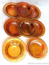 Set of 8 Carnival glass dessert or fruit dishes are about 6-1/2" wide. Tiny chipping noted on inner
