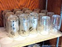 Set of nine 5-1/2" silver leaf pattern glasses and seven vintage 4-3/4" frosted grapevine pattern