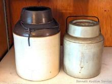 Two bale top stoneware fruit jars are about 6" and 7-1/2" tall. Some hairline cracking in larger and