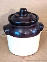 Charming little stoneware pot with lid is about 6" tall to shoulder. Factory flaw in foot of pot and
