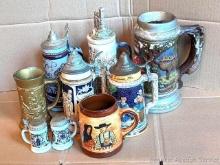 Variety of 8 different beer steins and mugs. Poem Stein is made in Germany. Other marked steins incl
