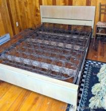 Located in basement, bring help to remove. Vintage blonde full size bed frame with spring.