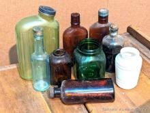 Located in basement, bring help to remove. No shipping. Vintage colored glass containers up to