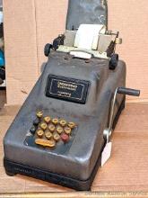 Located in basement, bring help to remove. Underwood Sundstrand adding machine is in overall good