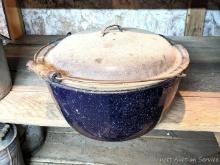 Located in basement, bring help to remove. Large speckled enamel pot with lid is about 15" wide.