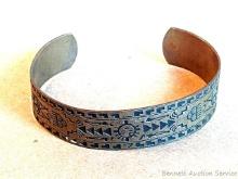 Aztec or tribal Southwest style copper bracelet is adjustable to accommodate most wrist sizes.