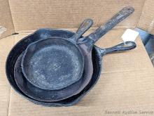 Located in basement, bring help to remove. No. 7 cast iron skillet is 10" and otherwise unmarked;