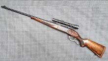 Savage Model 99 lever action rifle in the desirable .300 Savage chambering has a brass shell