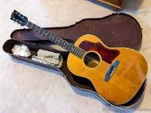 Vintage Gibson acoustic guitar is ready for restoration and comes with case. Measures 40" overall.