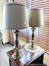 Two matching heavy, brass lamps with very clean cloth lamp shades. In very good condition. Two small
