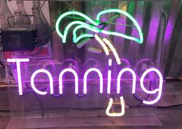 Tanning Neon mounted on clear plex