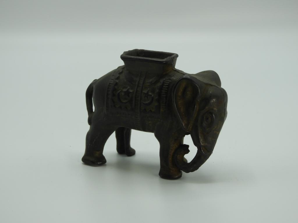 Cast iron elephant bank , 4"Wx3"T