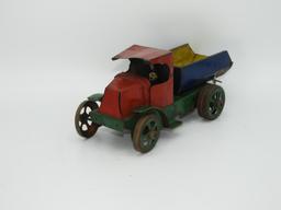 30's style stamped tin wind up dump truck, 9"L