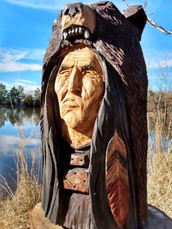 Hand carved wooden Indian head with bear headdress