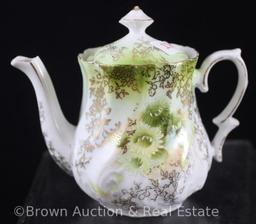 Unm. Child's set: 4.25"h teapot, 2.25"h creamer and open sugar, green floral d?cor on white swirl