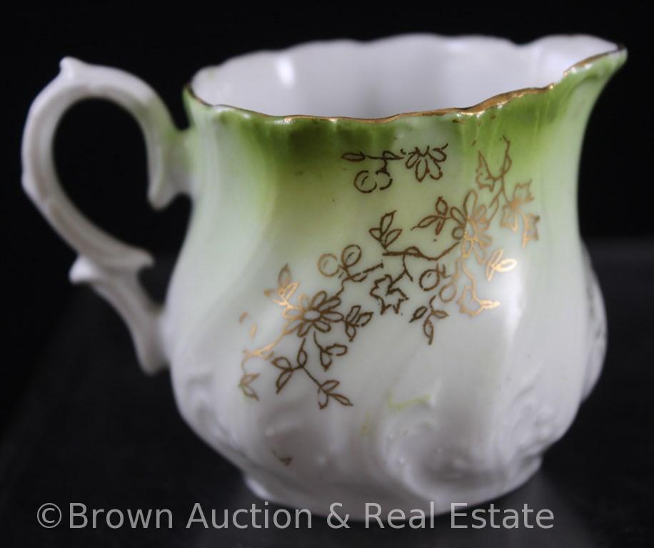 Unm. Child's set: 4.25"h teapot, 2.25"h creamer and open sugar, green floral d?cor on white swirl
