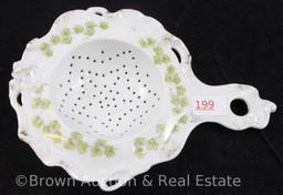 (2) Unm. RSP tea strainers, floral decorations