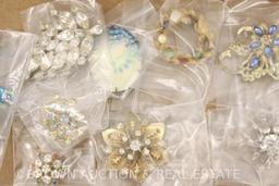 Box lot of costume jewelry, mostly brooches and pins