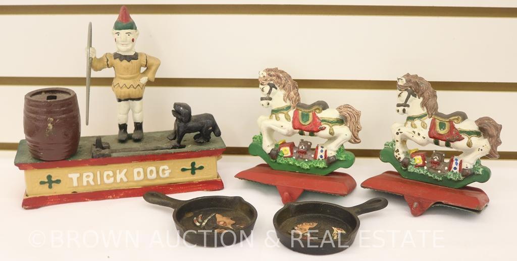 (5) Cast Iron items: Christmas stocking hangers, skillet ashtrays w/Indian head, repro "Trick Dog"
