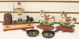 (5) Cast Iron items: Christmas stocking hangers, skillet ashtrays w/Indian head, repro "Trick Dog"