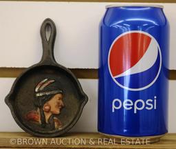 (5) Cast Iron items: Christmas stocking hangers, skillet ashtrays w/Indian head, repro "Trick Dog"