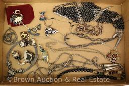 Box lot of costume jewelry incl. necklaces and brooches, lots of black and some animal pieces