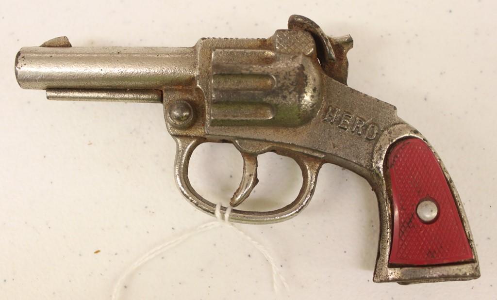 Vintage cast cap gun, "Hero" (handle damage on one side)