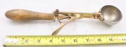 Vintage mechanical scoop, wood handle, brass hardware, 10.5" long overall