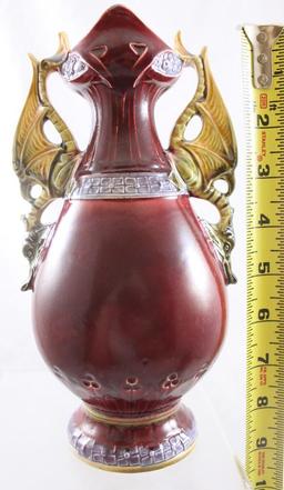 Unmarked 9"h porcelain vase with figural grotesque bird handles, portrait of woman on dark maroon