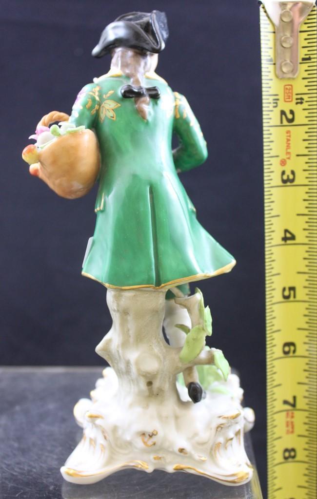 Pr. 7.5"h figurines, Victorian man and woman holding their catch of the day and baskets of flowers