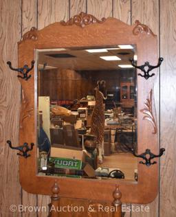 Oak hall tree with lift-lid seat, large beveled mirror, 4 coat/hat hooks, carved applications, 6'10"