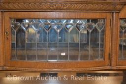 Large Oak sideboard/buffet, top & bottom have curved leaded glass doors, other drawers for storage,