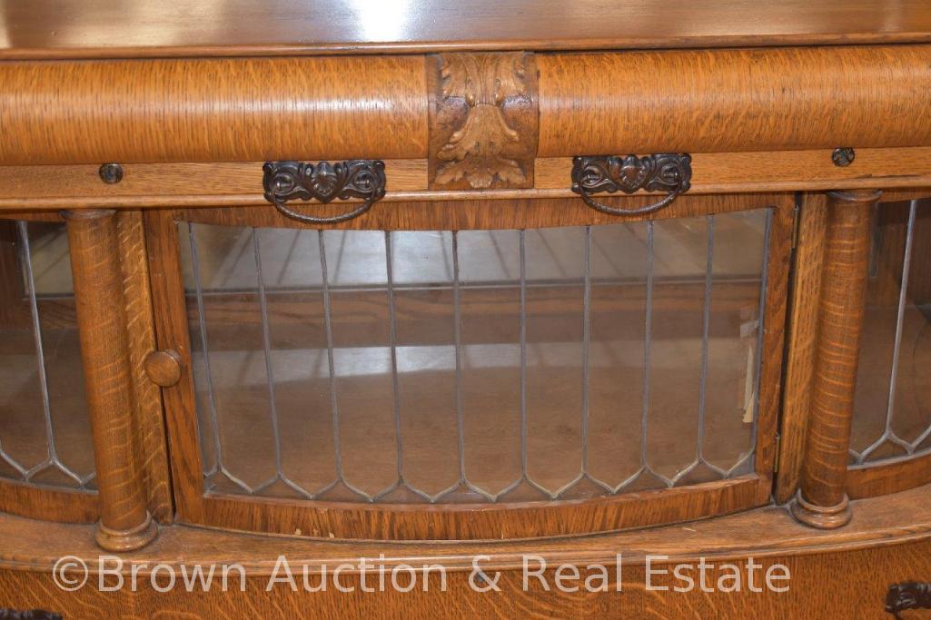 Large Oak sideboard/buffet, top & bottom have curved leaded glass doors, other drawers for storage,