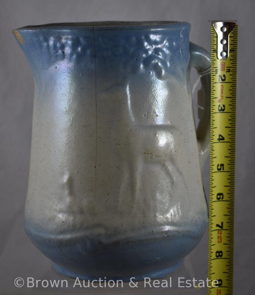 (2) Blue and white Stoneware pitchers, 8.5"h (both have hairlines): Swastika/Indian Good Luck and