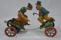 Mrkd. Made in Germany tin wind-up toy, fighting husband (armed with cane) and wife (armed with