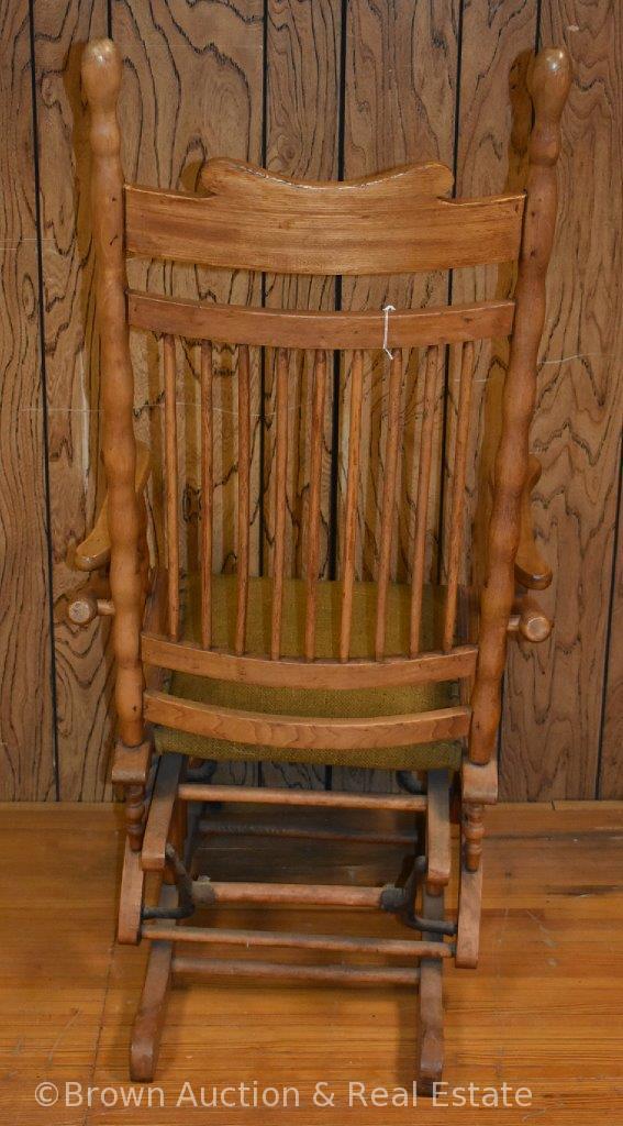 Antique Oak glider rocker, spindle back, upholstered seat **BROWN AUCTION WILL NOT SHIP THIS ITEM.