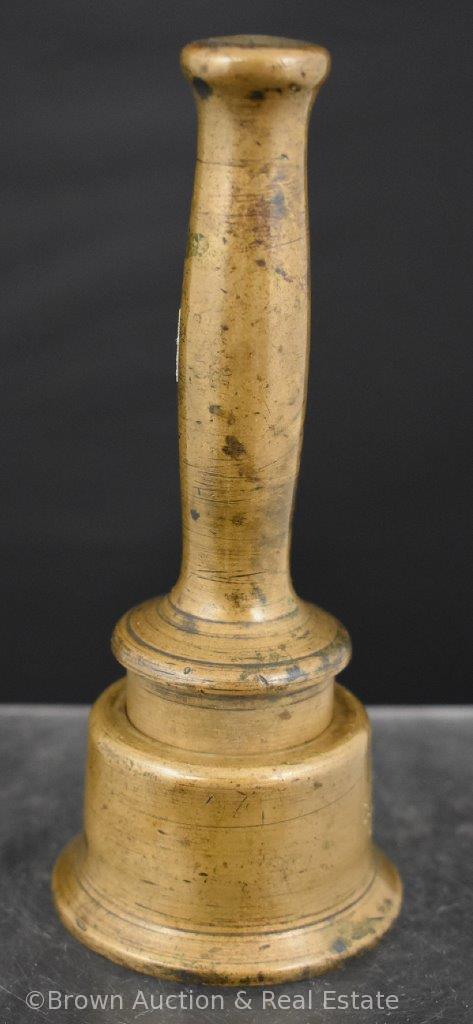 Solid brass pestle of some sorts with holder