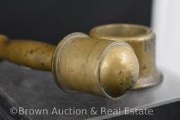 Solid brass pestle of some sorts with holder