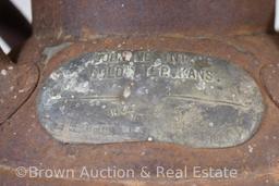 Old cream can with attached metal tag - John McIntyre, Coldwater, KS