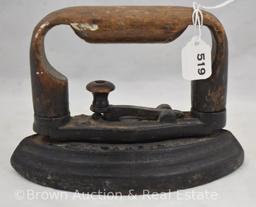 Sad iron with wooden handle