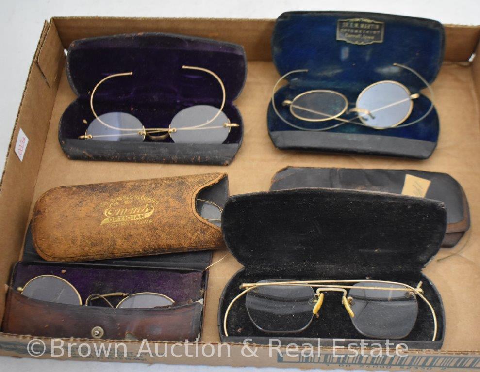 Assortment of old eye glasses and cases, many gold rim