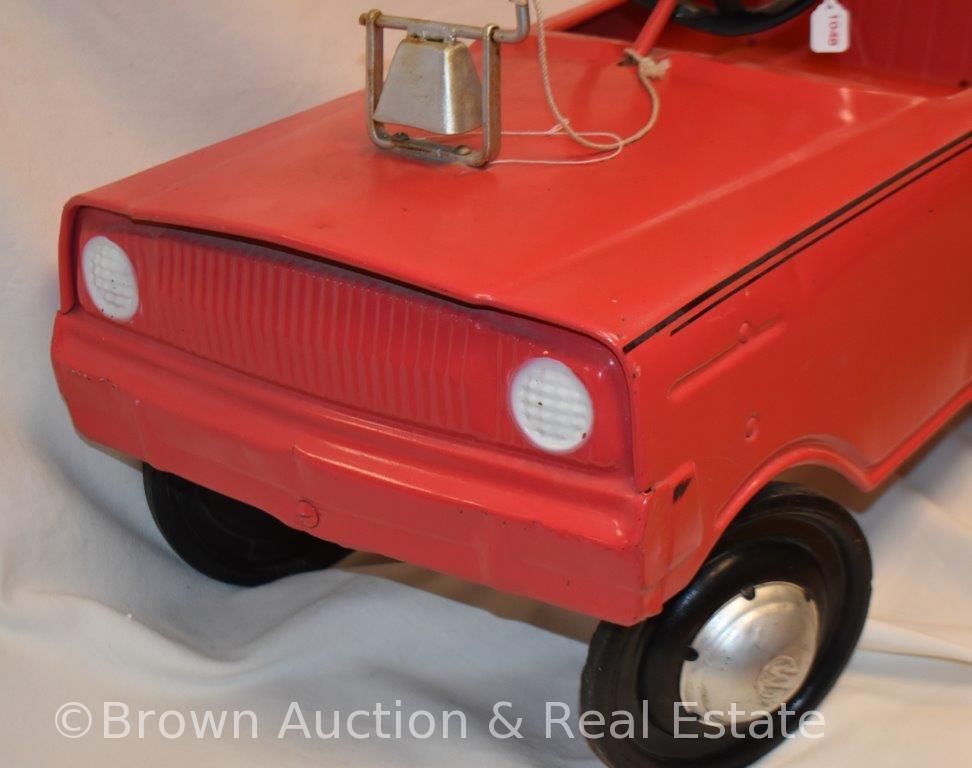 Vintage child's pink pedal car