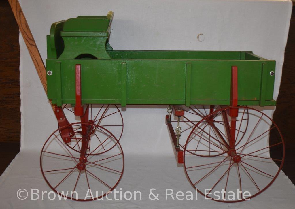 Hand-made buckboard wooden wagon on Studebaker frame