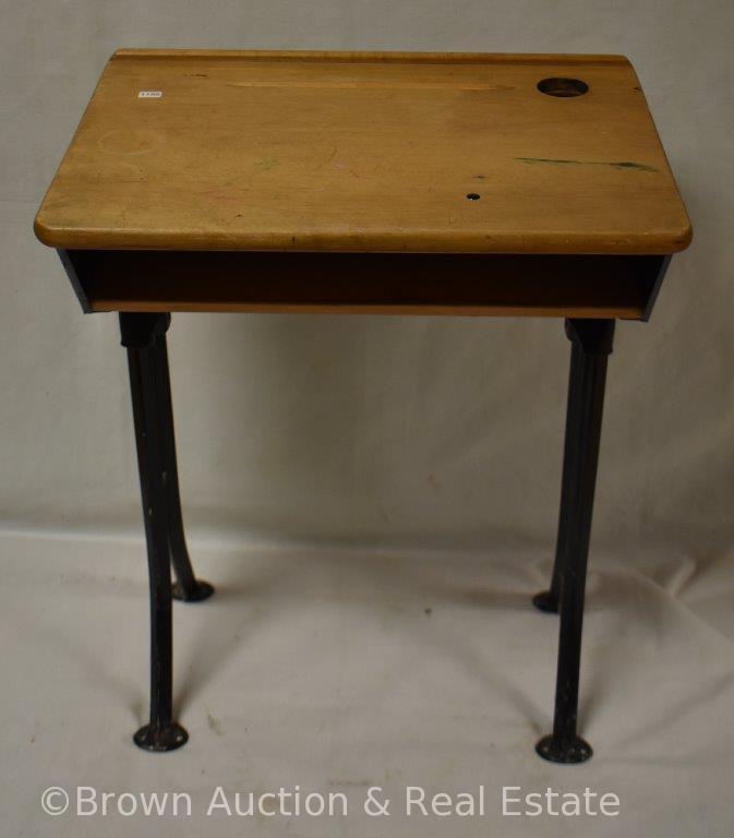 Vintage child's school desk with ink bottle hole