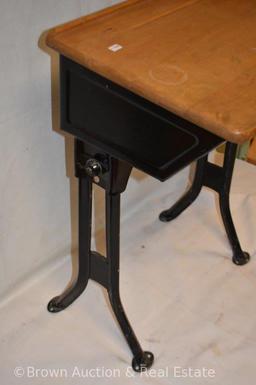 Vintage child's school desk with ink bottle hole