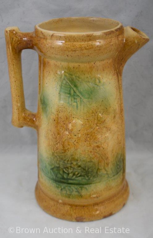 Stoneware 10.5"h tankard with embossed decoration